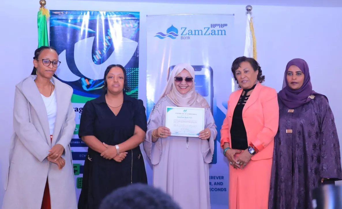 photo showing zamzam bank receiving share registration from Wegagen investment bank ceo brutawit